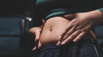 Women body fat belly. Obese woman hand holding excessive belly fat. diet lifestyle concept to reduce belly and shape up healthy stomach muscle. video