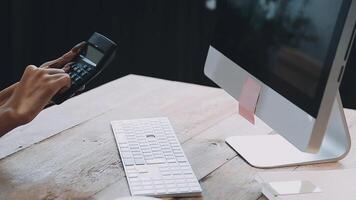 Startup small business SME, Entrepreneur owner African woman using smartphone or tablet taking receive and checking online purchase shopping order to preparing pack product box. video