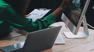 Startup small business SME, Entrepreneur owner African woman using smartphone or tablet taking receive and checking online purchase shopping order to preparing pack product box. video