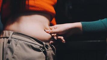 A woman who touches the belly meat, diet image video