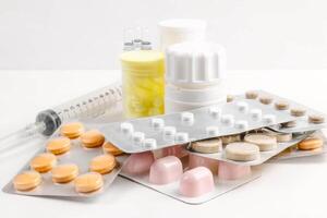 Medications of various types and forms of the factor for multifunctional use and an injection tool on a white background photo