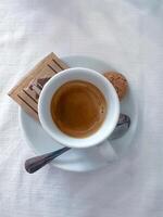 Cup of italian espresso on white background photo