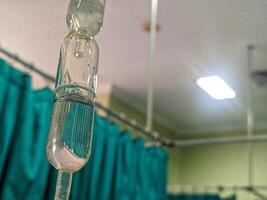 Medicines in the ICU. Medicinal lines next to the bed of the patient, infusion hose and bottle photo