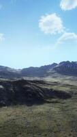An aerial view of a mountain range in the mountains video