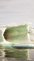A wide low angle view of melting sea ice floes in still waters of Arctic video