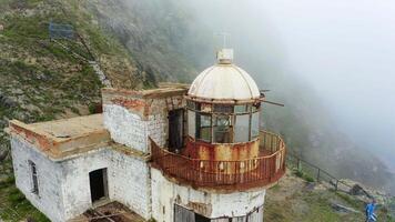 Drone view on old lighthouse on Askold Island in the fog video