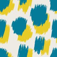 Blue and yellow spots with jagged edges form a leopard spotted seamless pattern for decorative pillows, wrapping paper, fabrics. vector