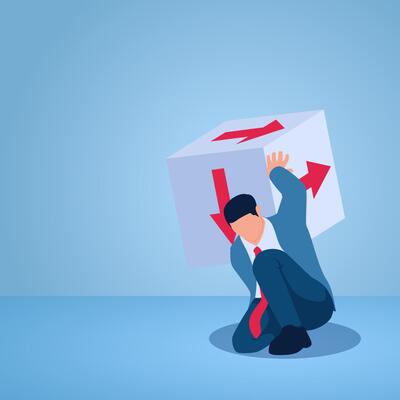 A man holds up dice containing arrows in various directions, an illustration of uncertainty.