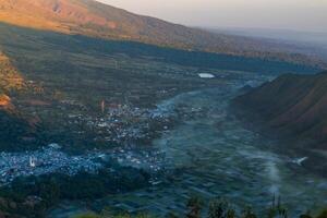 View of Sembalun village with a thin mist in the morning photo