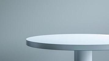 A minimalist white round tabletop with a gray background, suitable for product displays. photo