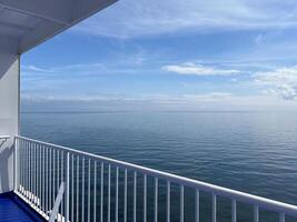 Sea view from the deck of a cruise ferry ship. Calm water without waves photo