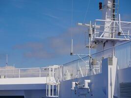 Radar antennas on board of a cruise ferry ship. Navigation system of the liner. Elements of radio location equipment in the ultrasonic wave range. photo