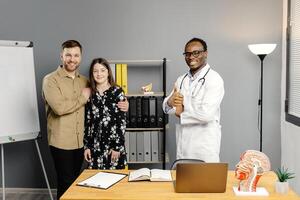 Group of people standing in front of whiteboard in doctors offices photo