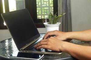 Asian people are using laptops to access internet banking photo