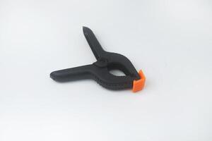 The clamp used to clamp the background is above the white background photo