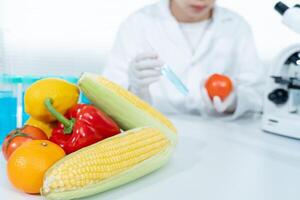 Scientist check chemical food residues in laboratory. Control experts inspect quality of fruits, vegetables. lab, hazards, ROHs, find prohibited substances, contaminate, Microscope, Microbiologist photo