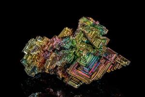 Macro of the stone bismuth mineral on a black background photo