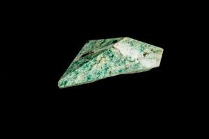 Nephrite mineral stone macro on a black background photo