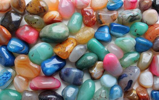 Pattern of flat surface of rough colorful gemstones closeup stock photo