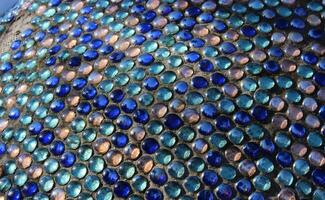 Glass Abstract Round Mosaic Pattern Of Penny Round Mosaic Glass In Concrete Basement photo