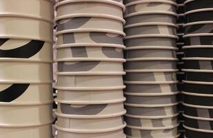 Painted paper cups lined up in columns arranged by color for coffee of different strengths photo