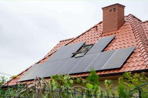 House roof with photovoltaic modules. photo
