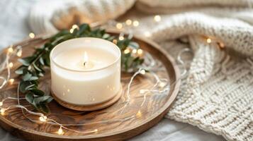Christmas scented candle on the wooden round plate and christmas trees, Boho Decor photo