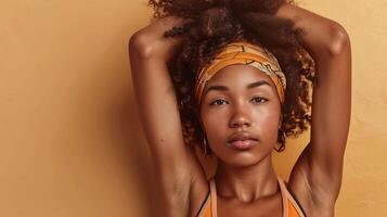 Portrait an Afro woman in workout clothes, stretching, isolated background photo