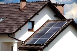 Installing a Solar Cell on a Roof. photo