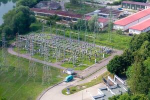Power plant - transformation station. Multitude of cables and wires. photo