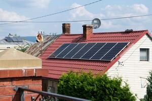 Historic farm house with modern solar panels photo