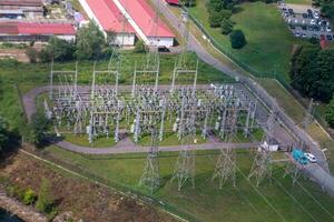 Power plant - transformation station. Multitude of cables and wires. photo