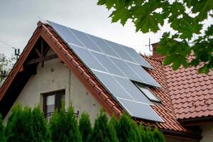 House roof with photovoltaic modules. photo