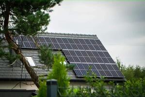 House roof with photovoltaic modules. photo
