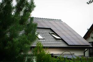 House roof with photovoltaic modules. photo