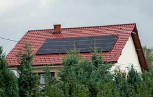 House roof with photovoltaic modules. photo