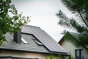 House roof with photovoltaic modules. photo