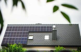House roof with photovoltaic modules. photo