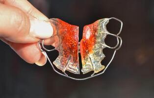 Red Retainer on a white background.Already used And is closely imaged. photo