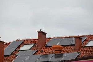 Installing a Solar Cell on a Roof. photo