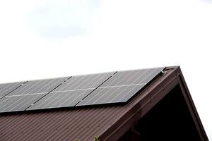 Installing a Solar Cell on a Roof. photo