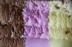 Closeup shot of an Ice cream with three different flavor photo