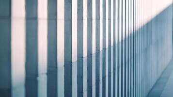 Close up of a sleek wall with light highlighting vertical grooves modern architecture light gray tones photo