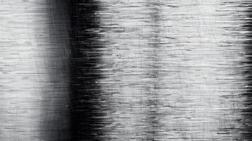 Close up of a brushed metal background with horizontal grain texture silver and gray tones photo