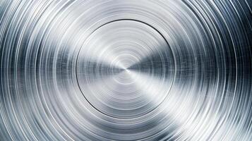 Metal background with a brushed circular pattern polished and shiny finish silver and light gray tones photo
