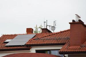 Installing a Solar Cell on a Roof. photo