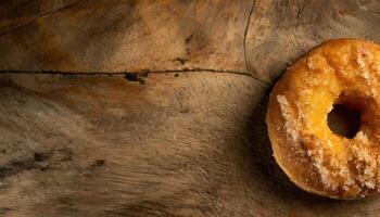 Copy Space image of Donuts with powdered sugar on wooden table on black background photo