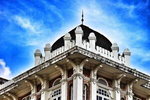 Kuala Lumpur, Malaysia on May 21, 2023. The top of the building and roof of the former chartered bank building photo