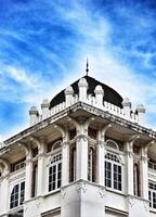 Kuala Lumpur, Malaysia on May 21, 2023. The top of the building and roof of the former chartered bank building photo