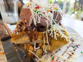 photo of a very appetizing waffle ice cream filled with cheese and chocolate toppings, usually used for regular menu covers as well as recipe book covers